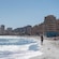 Guests strolling along and relaxing on a sandy beach